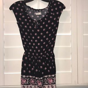 Black romper with pink and white flower patterning